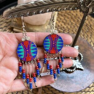 Southwest style handspainted earrings 4” by 1”.